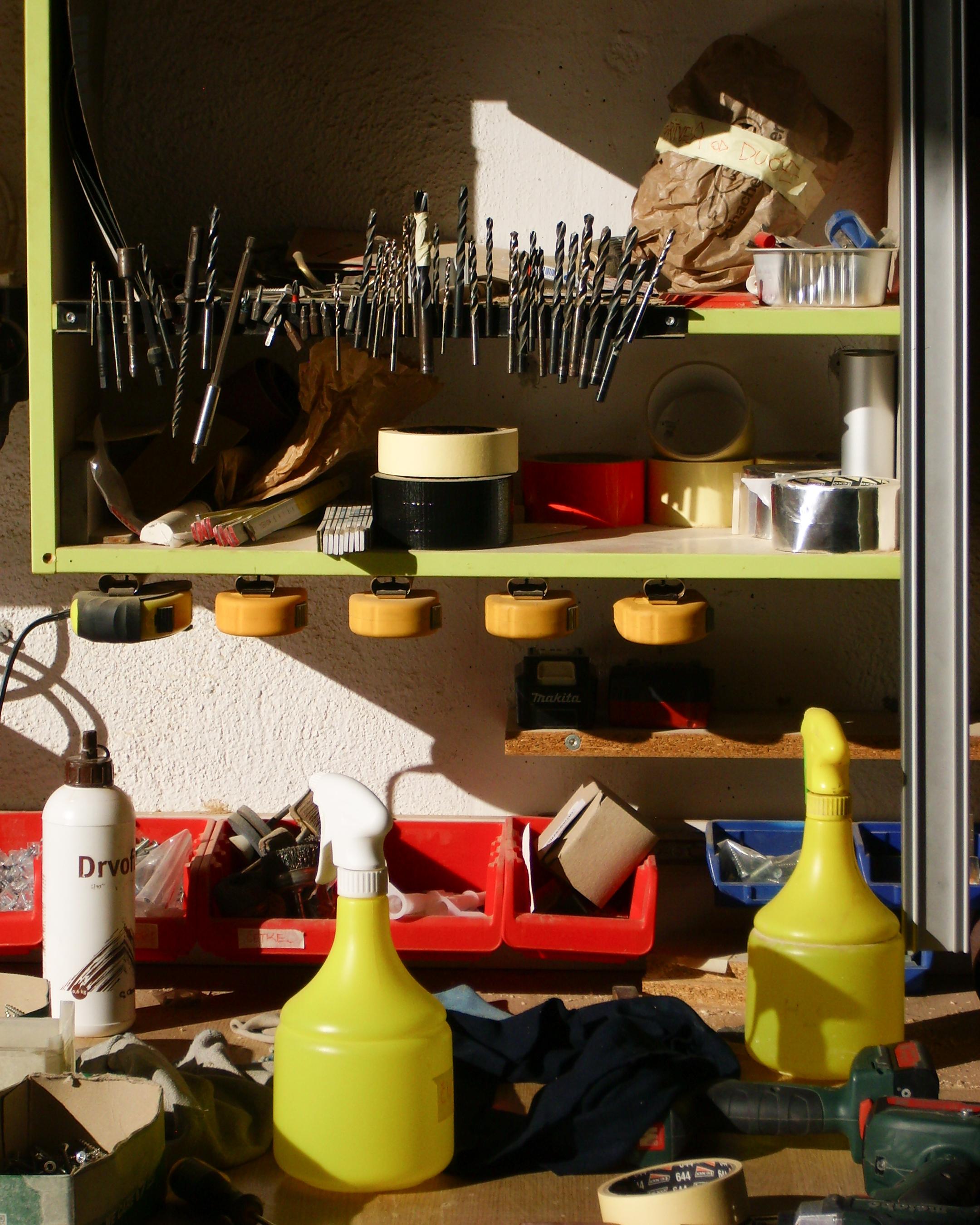 A messy closeup of a table at a workshop.